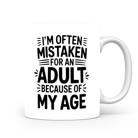Hrnek s vtipným nápisem – Mistaken for an Adult