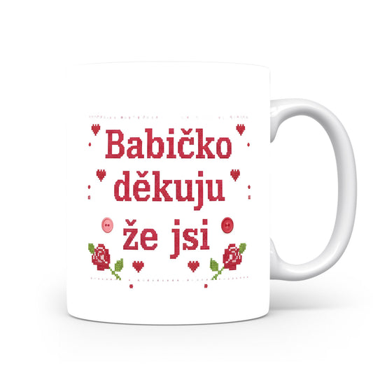 Hrnek s nápisem 'Babičko děkuju, že jsi', zdobený červenými růžemi a srdíčky.
