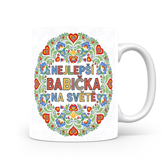 Hrnek s nápisem NEJLEPŠÍ BABIČKA NA SVĚTĚ a květinovými motivy.