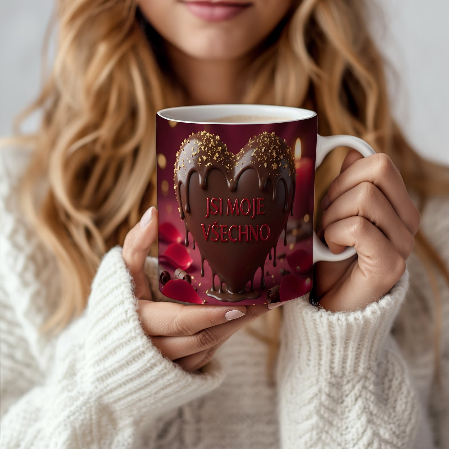 Hnědé srdce s čokoládovými kapkami a zlatými třpytkami na červeném pozadí.