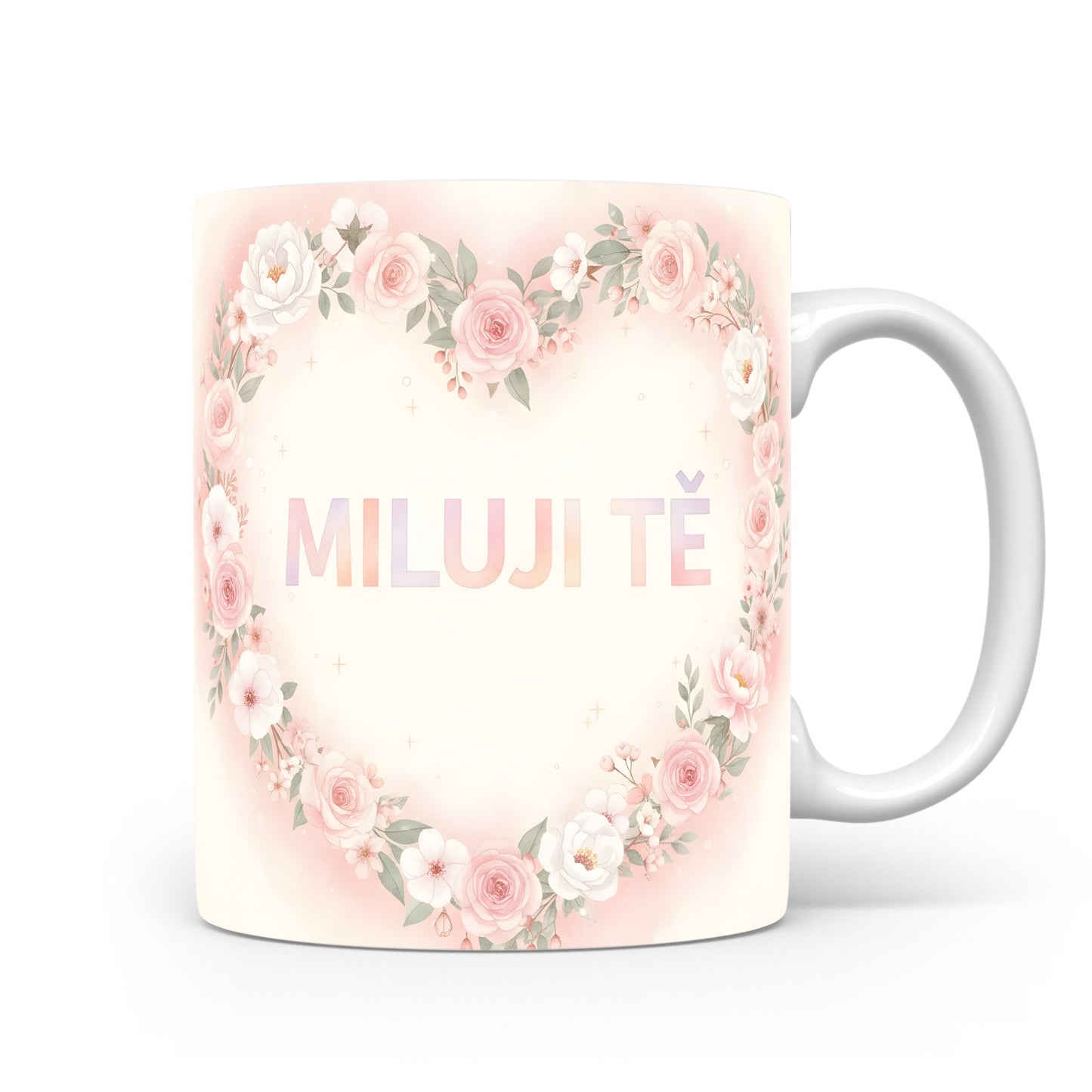 Hrnek s nápisem MILUJI TĚ a květinovým srdcem v pastelových barvách.