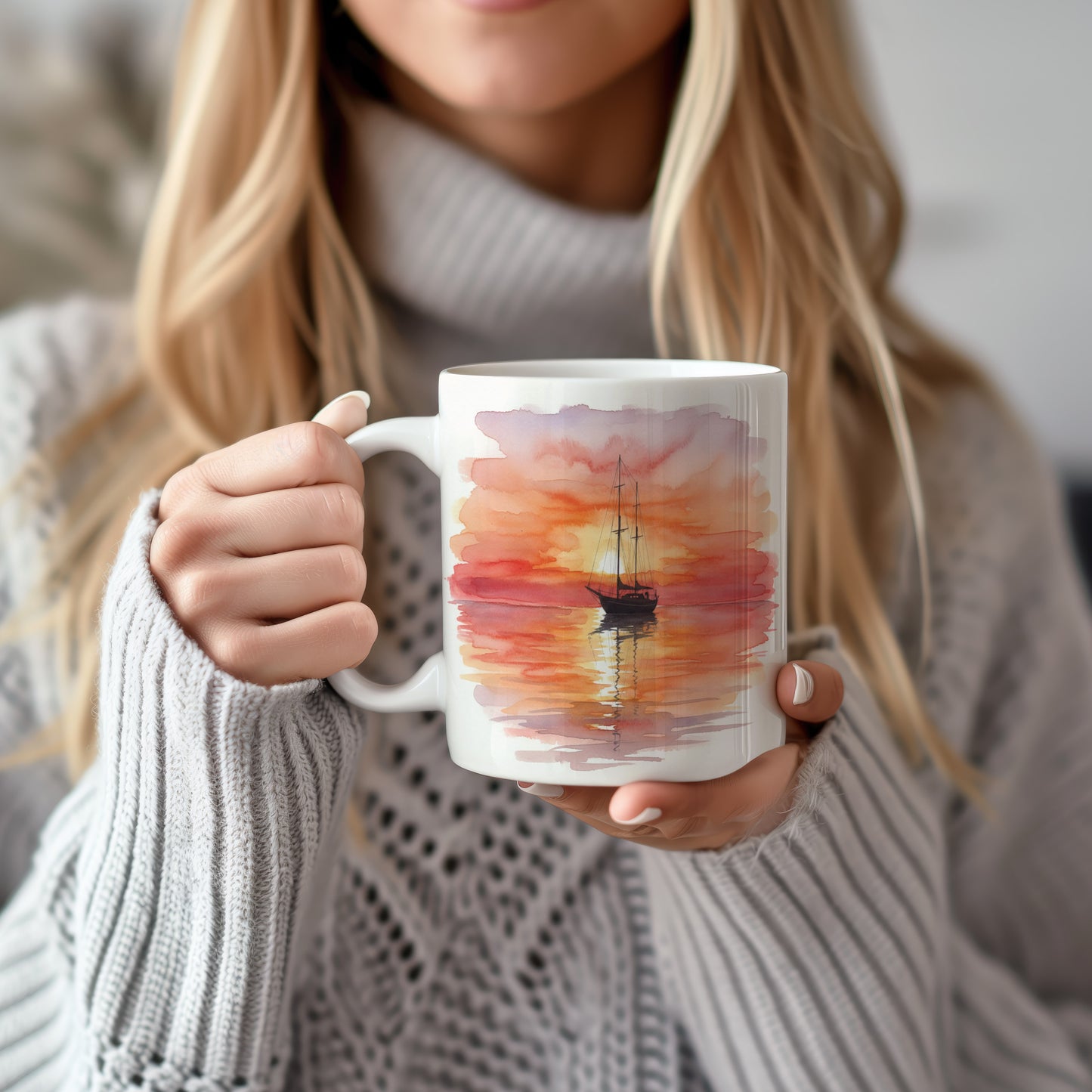 Hrnek s plachetnicí při západu slunce