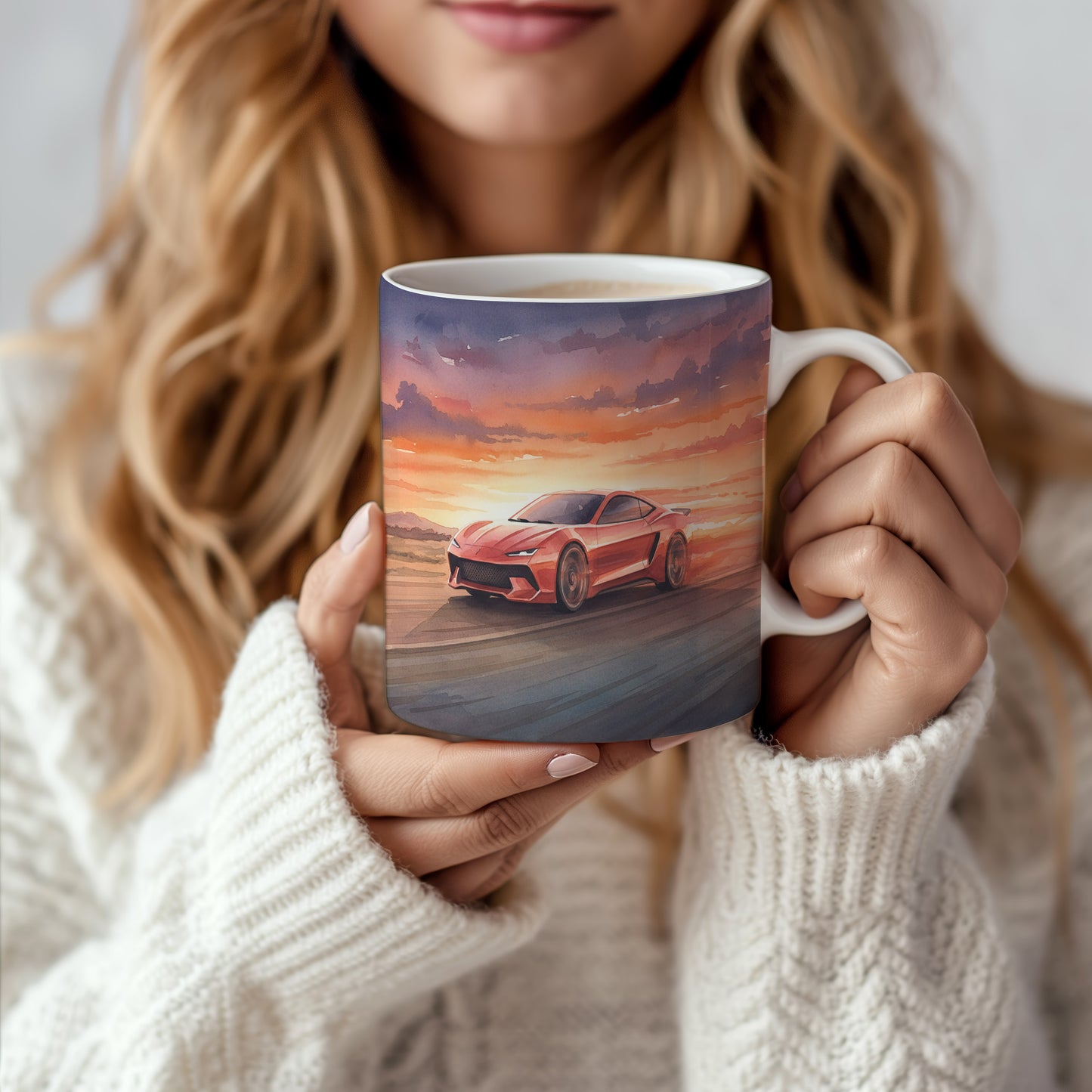 Hrnek s červeným sporťákem při západu slunce