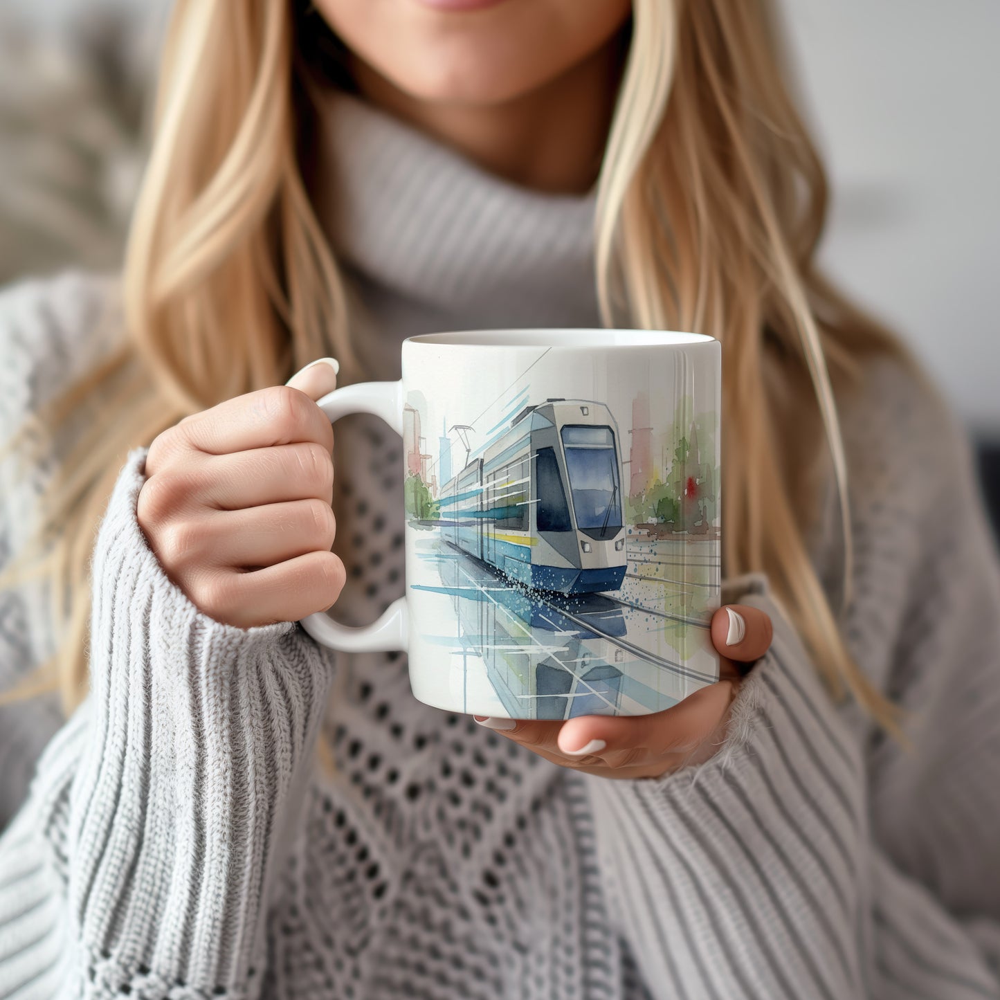 Hrnek s tramvají na mokrých kolejích