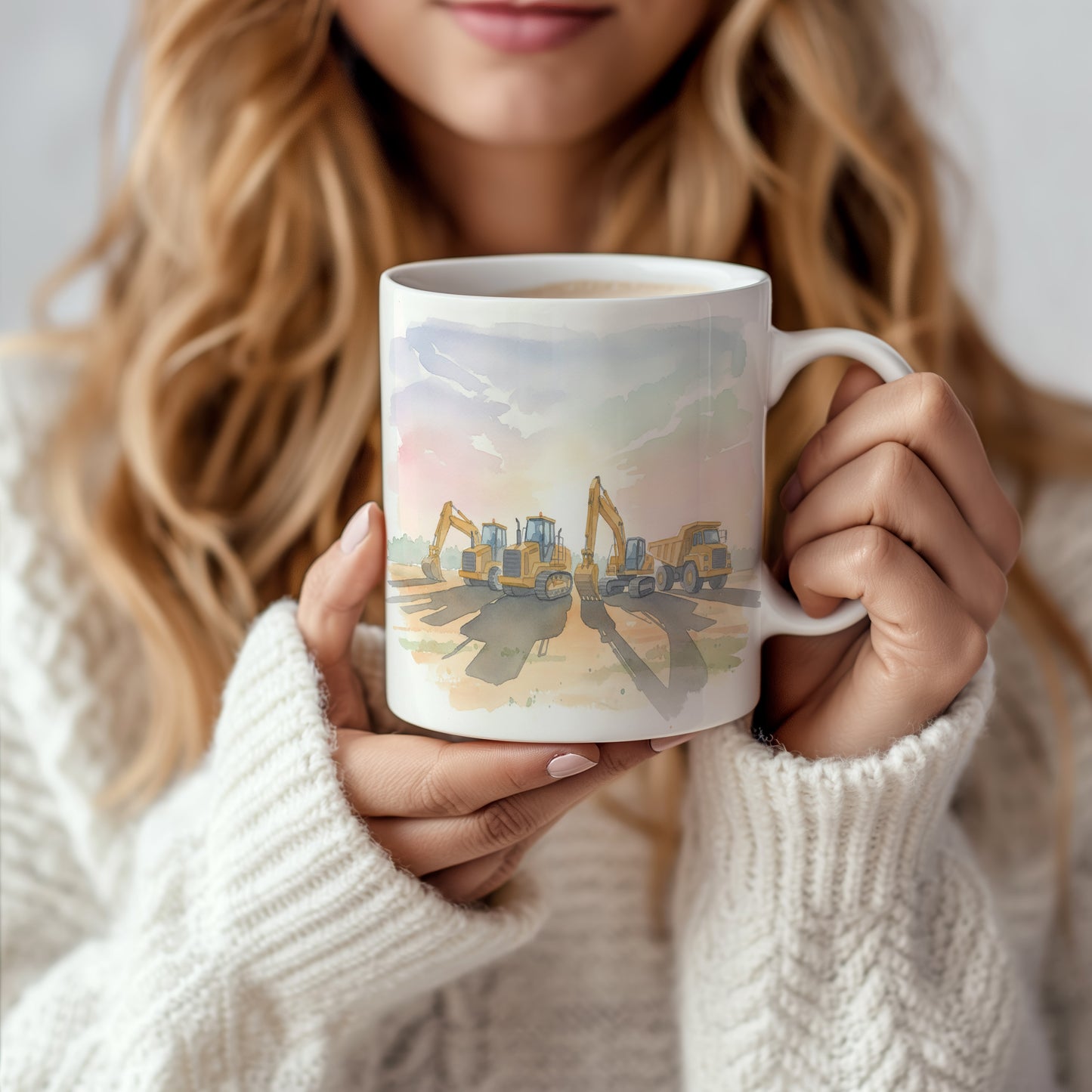 Hrnek se stavebními stroji při západu slunce